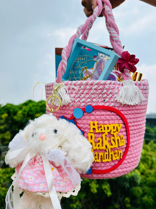 JUGNU STORE Raksha Bandhan Gift Hamper for Sister | Premium Pink Gift Basket with 300 ml Stainless Steel Leakproof Flask, Anti Tarnish Pendant, Plush Bunny Keychain, Mini Perfume Set, Chocolates & Snacks | Rakhi Gift for Girls & Women