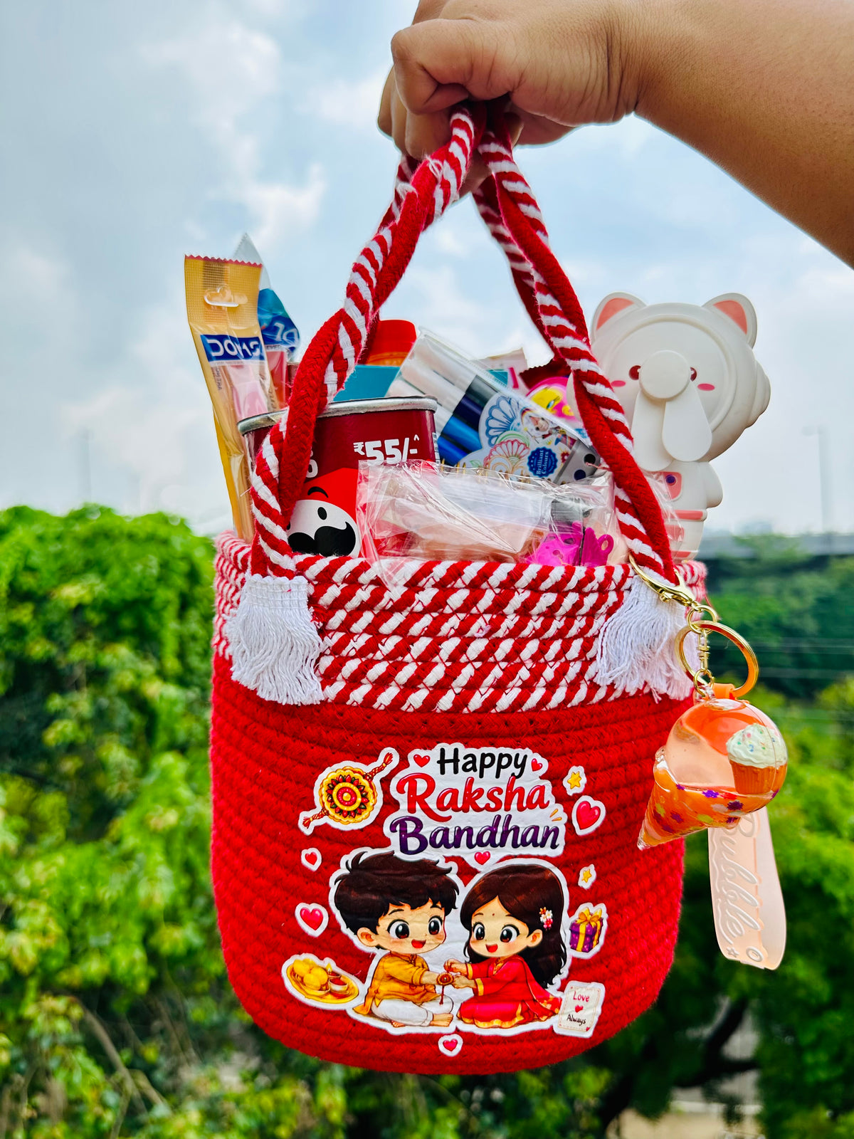 Jugnu Store Raksha Bandhan Gift Hamper for Girls | Premium Handmade Reusable Cotton Rope Basket with Chocolates, Stationery, Bubble Fan & Cute Accessories | Rakhi Gift Basket for Sister, Kids & Teens | 16+ Surprise Items