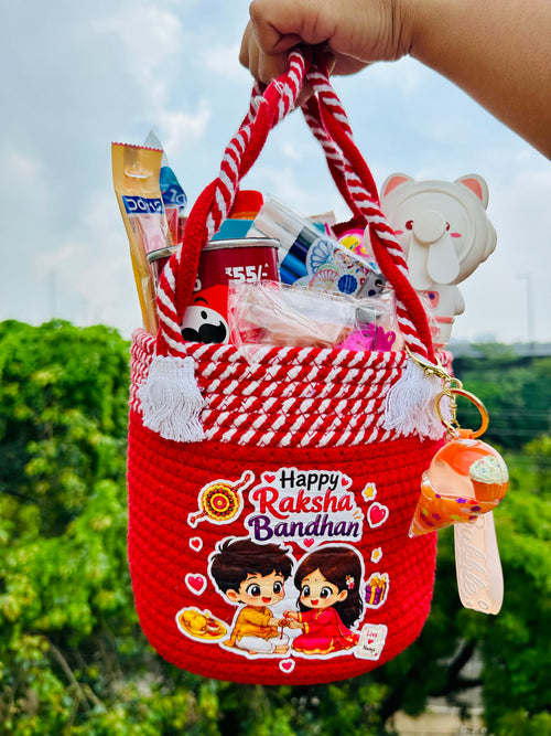 Jugnu Store Raksha Bandhan Gift Hamper for Girls | Premium Handmade Reusable Cotton Rope Basket with Chocolates, Stationery, Bubble Fan & Cute Accessories | Rakhi Gift Basket for Sister, Kids & Teens | 16+ Surprise Items